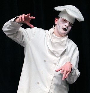Photo of boy in chef's uniform with ghoulish make-up