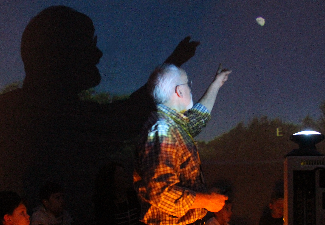 Mr Pixley points to the moon