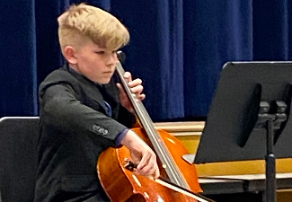boy plays cello