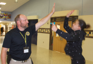 officer atkinson high five