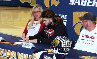 Dylan Andrade signs college letter