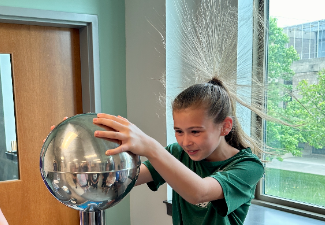 girl's hair reacts to static electricity