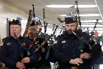 bagpipers play at brookside