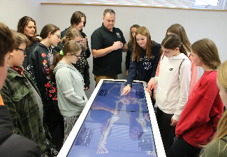 RTS students look at skeleton at SPARK event