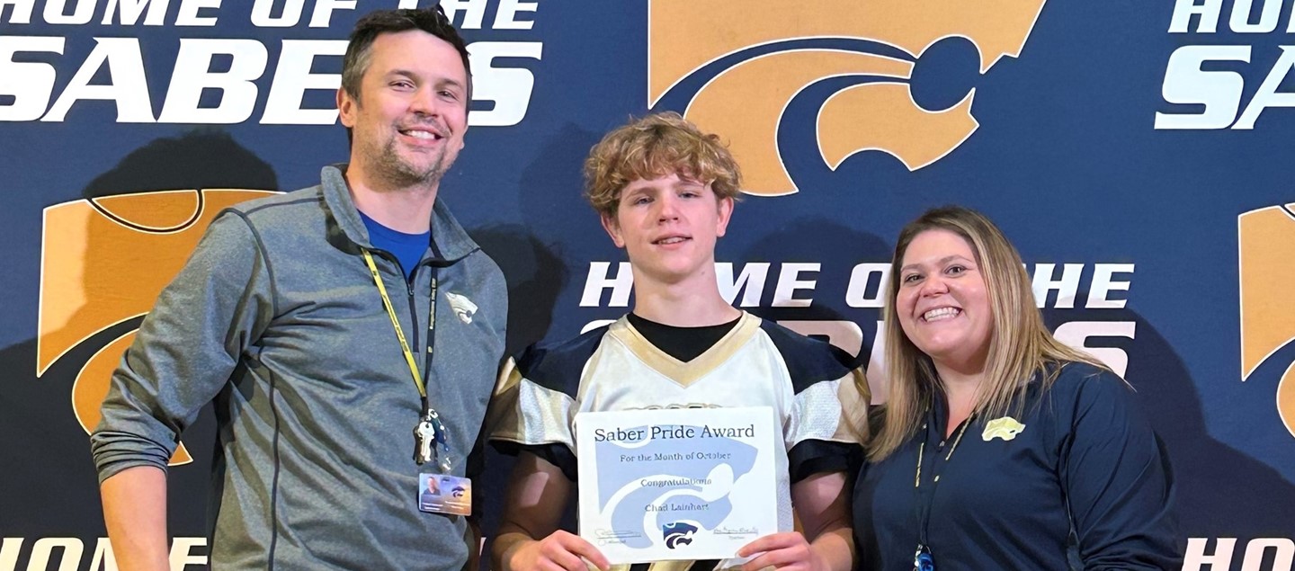 Saber pride award winner with administrators