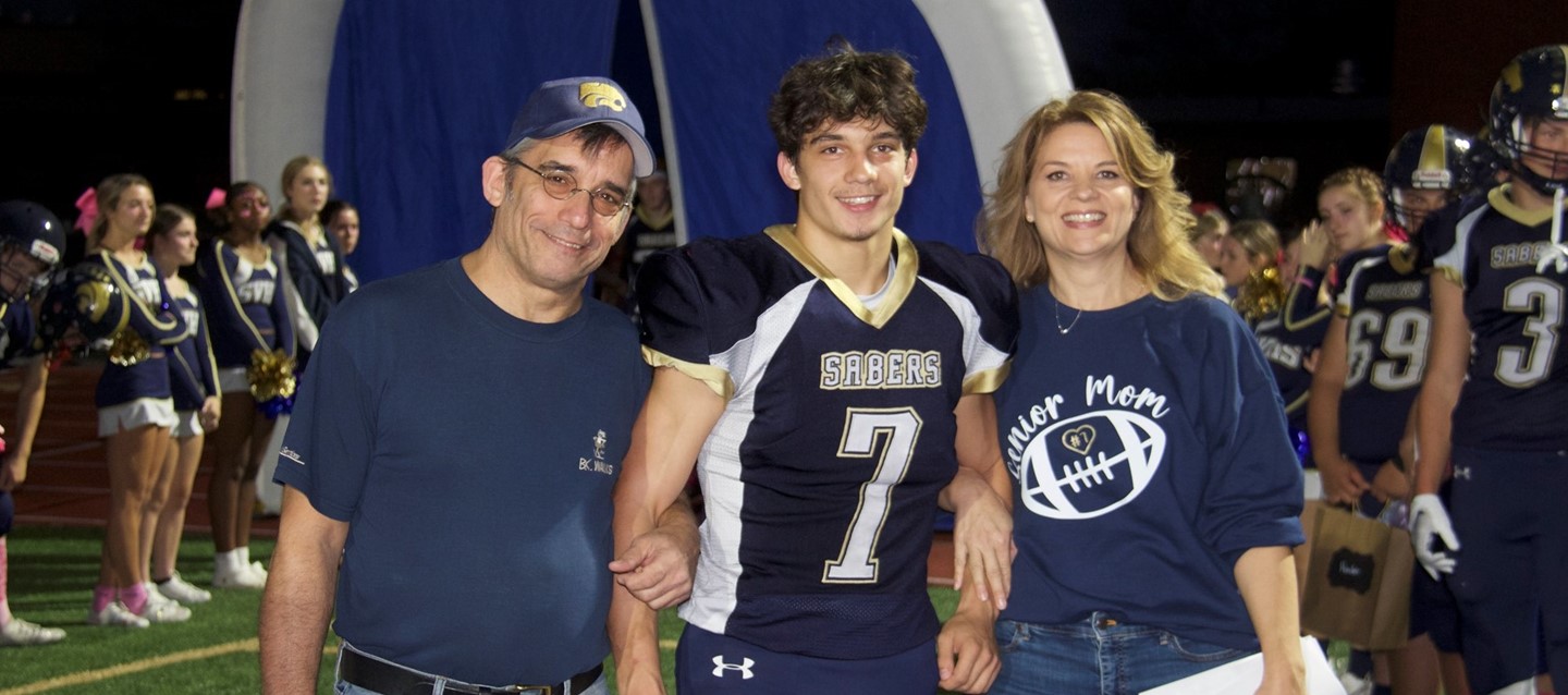 football senior and parents