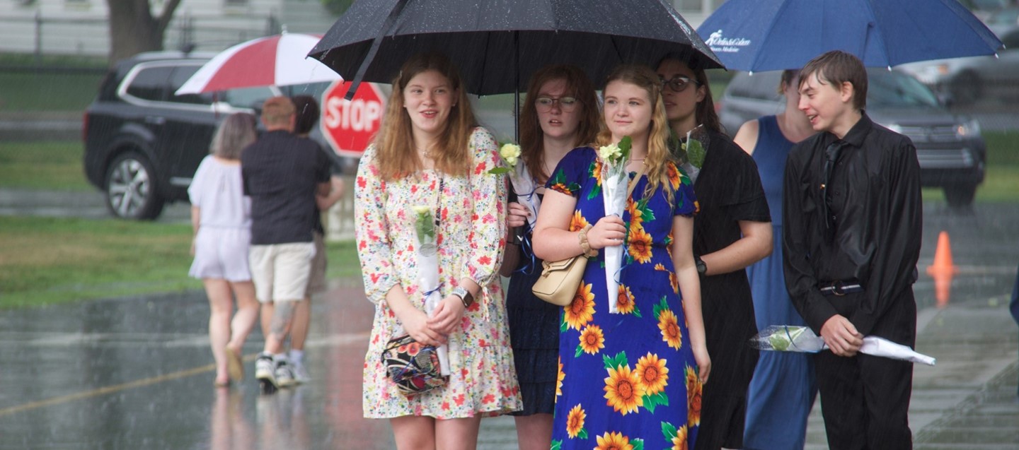 Soggy students wait