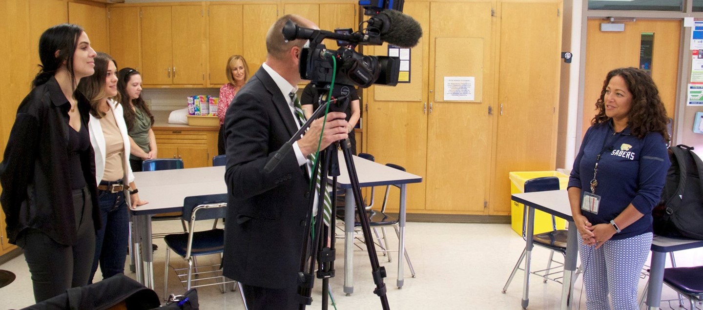 Teacher interviewed for television news story