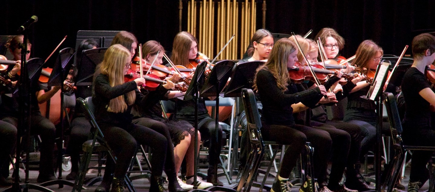 musicians play during middle school winter concert