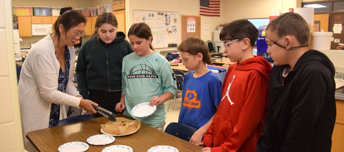 Sixth-grade students make apple fritters in Family and Consumer Science class at R T S middle school.