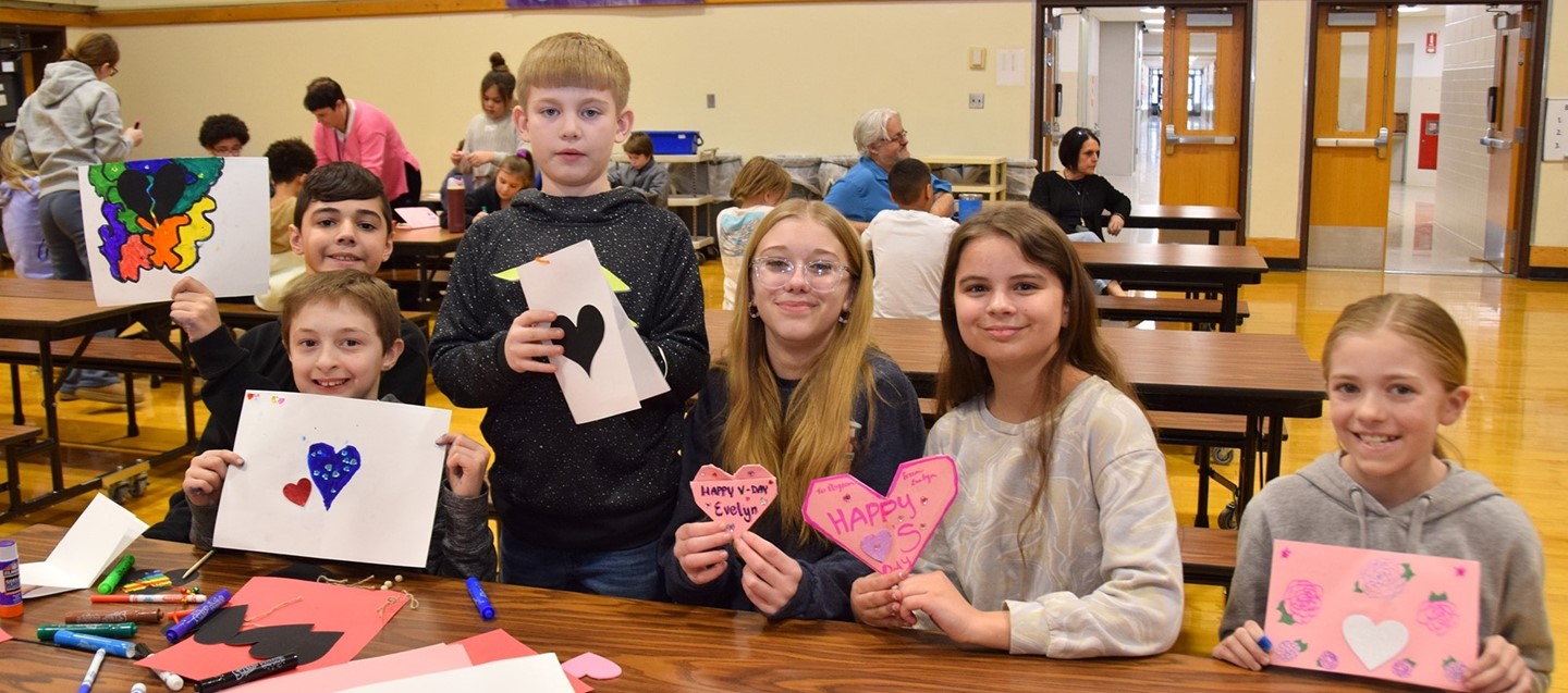 Donnelly Elementary fourth and fifth graders work on Valentines with their high school mentors.