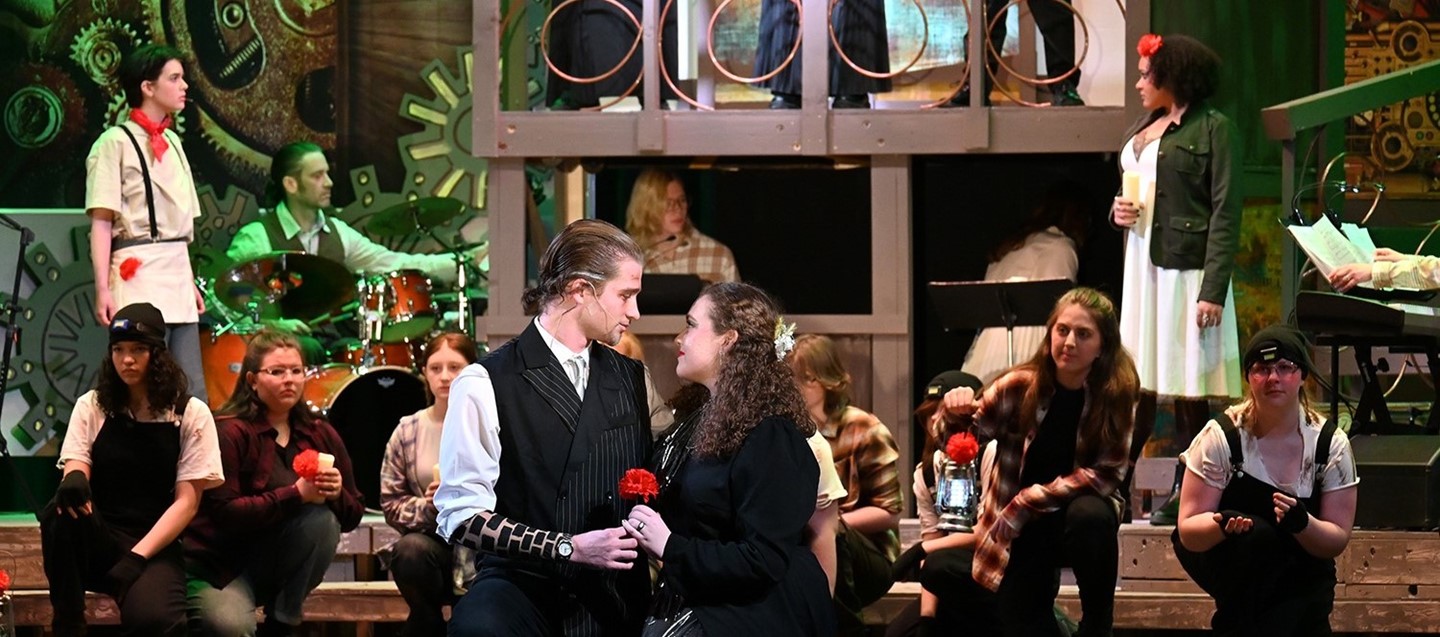 Susquehanna Valley High School student cast of Hadestown on stage during a performance.