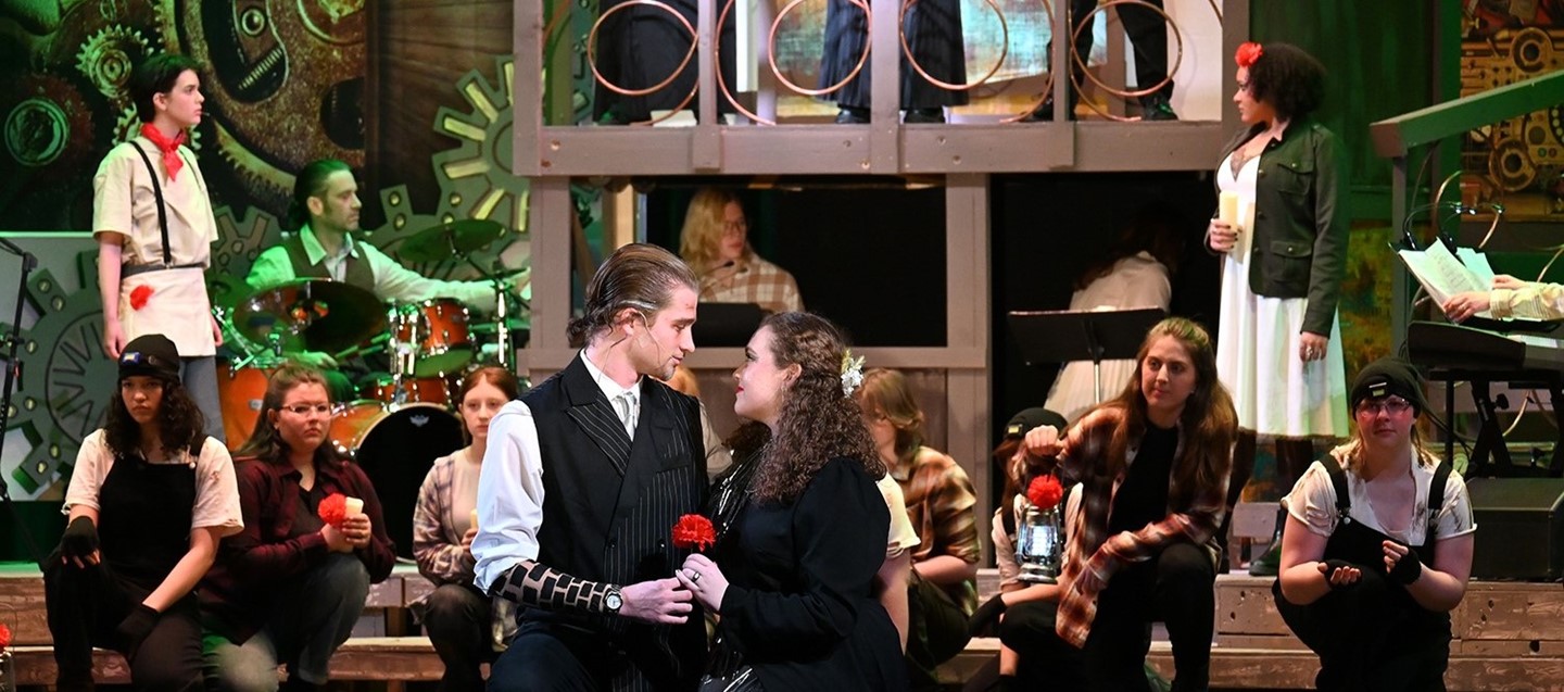 Susquehanna Valley High School student cast of Hadestown on stage during a performance.