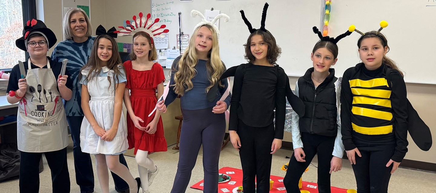 Seven Donnelly Elementary students on the Odyssey of the Mind team with their teacher advisor.