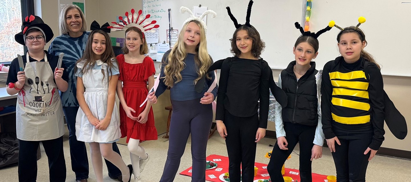 Seven Donnelly Elementary students on the Odyssey of the Mind team with their teacher advisor.