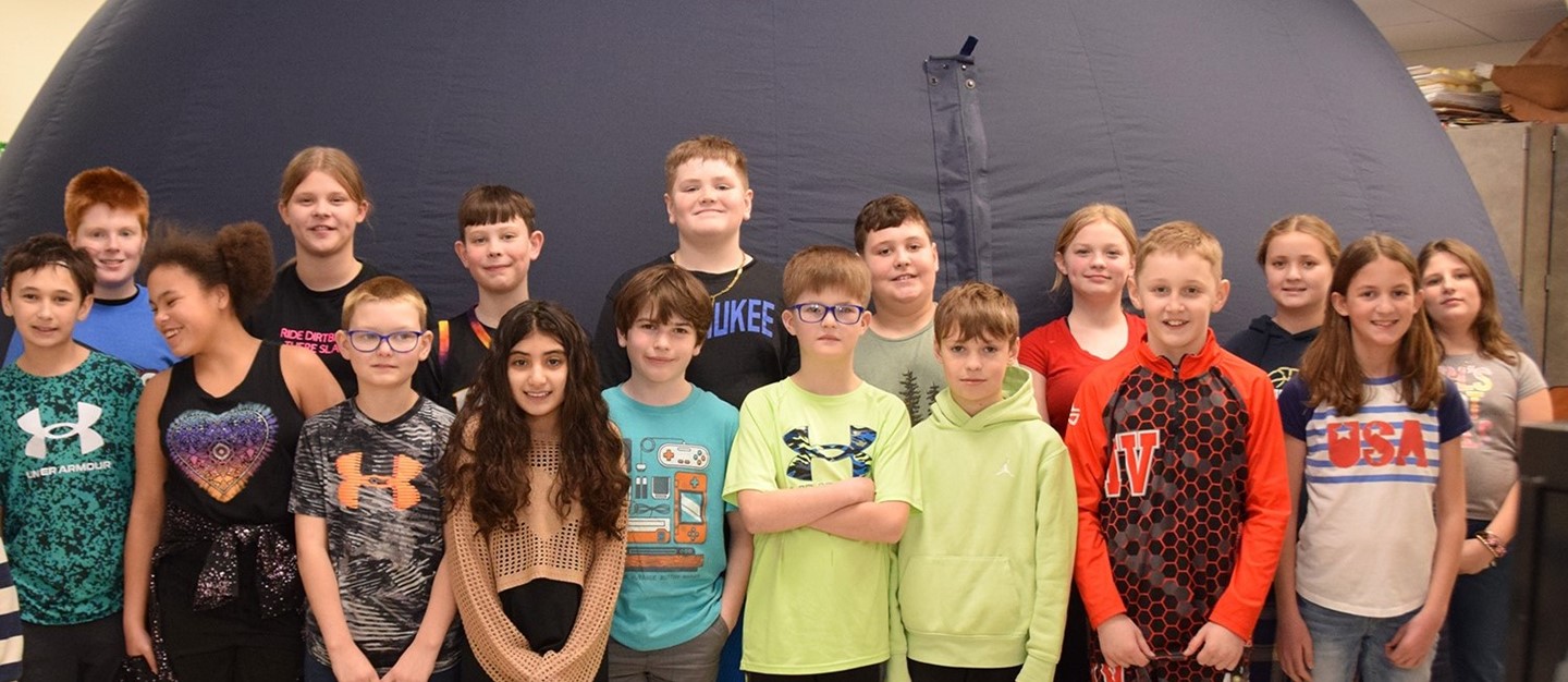 Brookside Elementary fifth graders in front of digital dome planetarium in March.